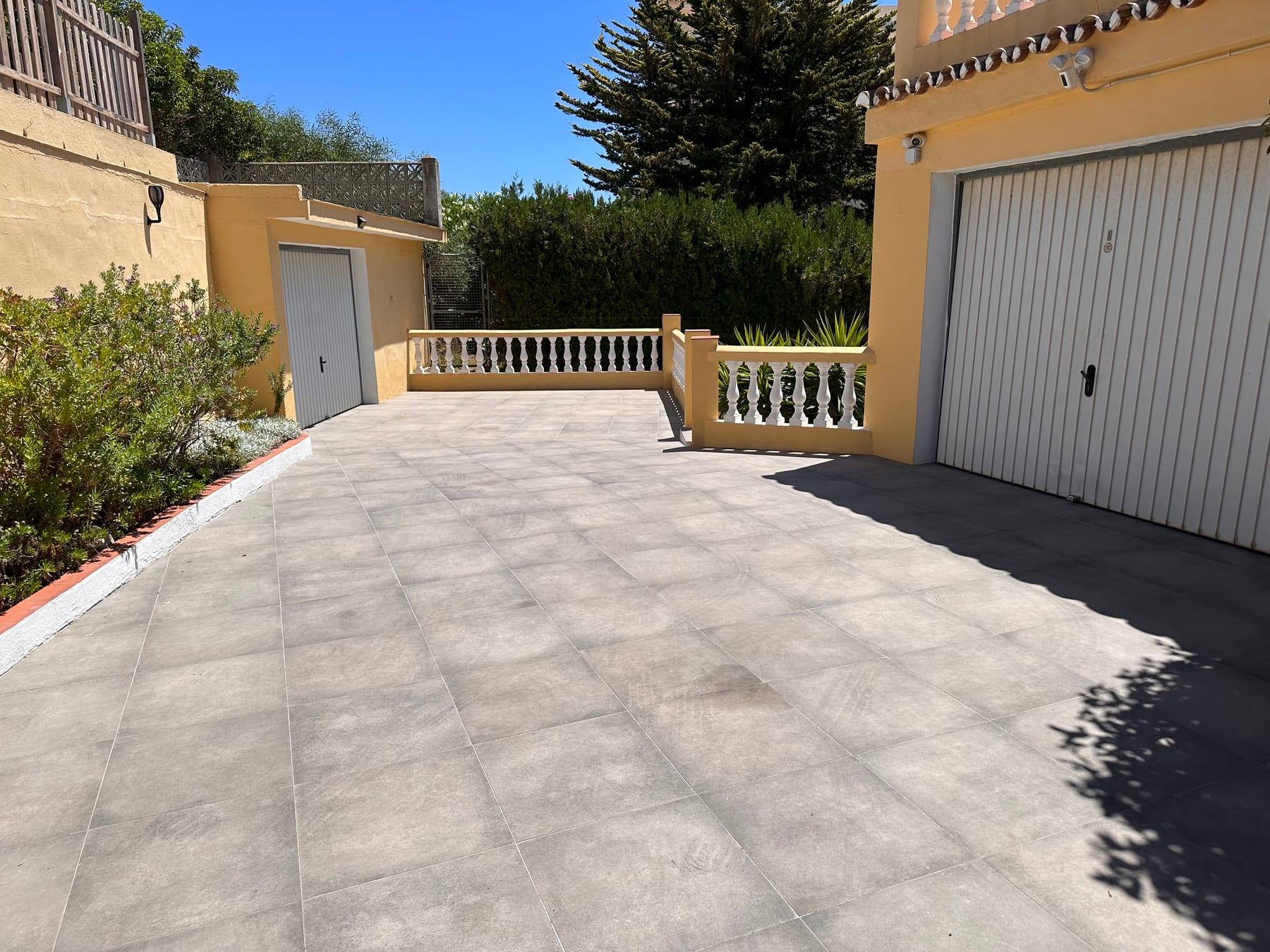 Tiled driveway and entrance courtyard